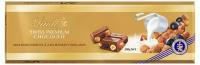 Шоколад молочный Lindt SWISS PREMIUM CHOCOLATE с изюмом и фундуком, 300 г