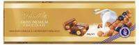 Шоколад молочный Lindt SWISS PREMIUM CHOCOLATE с изюмом и фундуком, 300 г