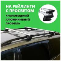 Багажник на крышу для Renault Sandero Stepway I (хэтчбек) 2010-2014 на рейлинги. Крыловидные дуги. Комплект из 2-х поперечин и 4-х опор багажника