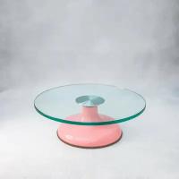 Поворотный столик с розовой ножкой и стеклянной поверхностью